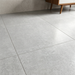 Kai White 600x600mm Lappato Floor Tile — living area setting